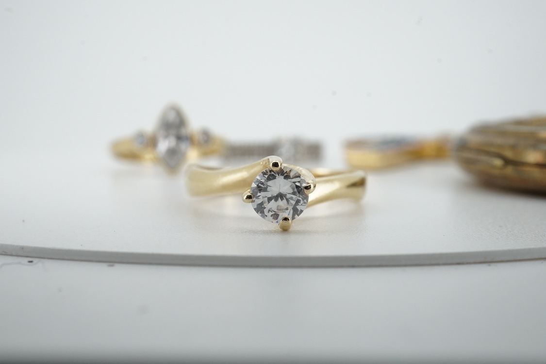 Two modern 9ct gold and cubic zirconia set rings, including white gold, two other simulated diamond set rings, together with an Italian cross pendant, a cameo brooch and an oval gilt metal locket.